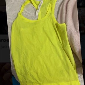 Lululemon top size 4 very bright fun color bought a week ago just the wrong size